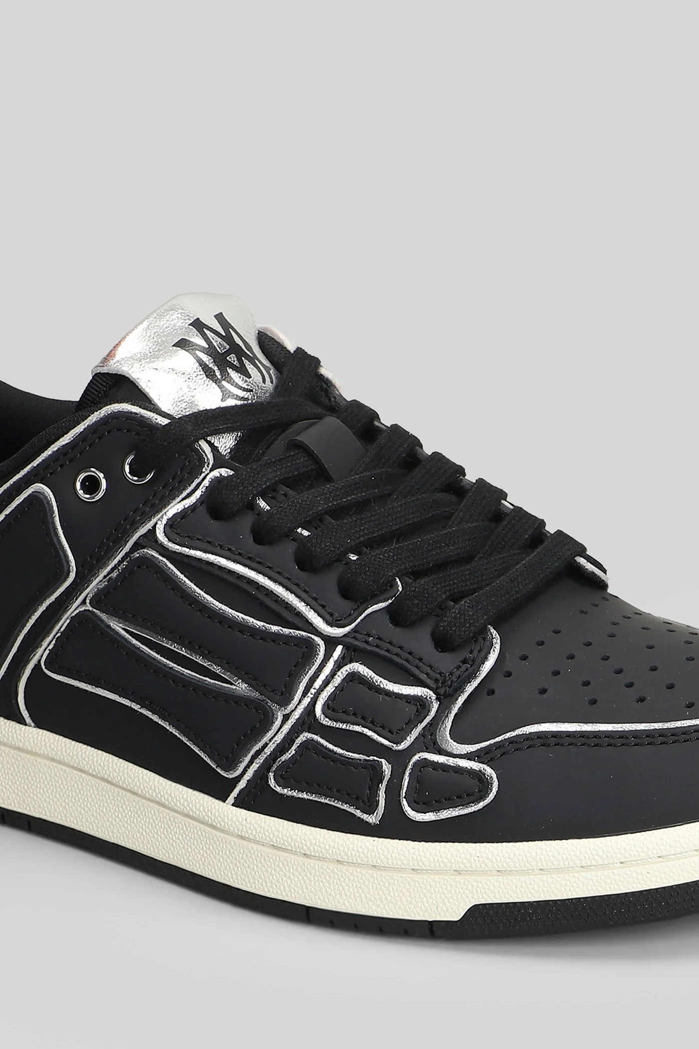 Amiri Skel top low Sneakers in black leather Scarpe